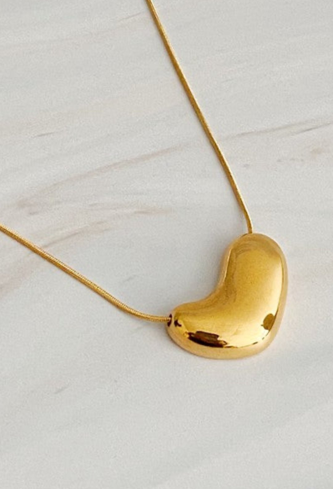 Bold Gold Molten Heart necklace, jewelry fashion store miami, danias store miami jewelry , heart necklace miami store.  